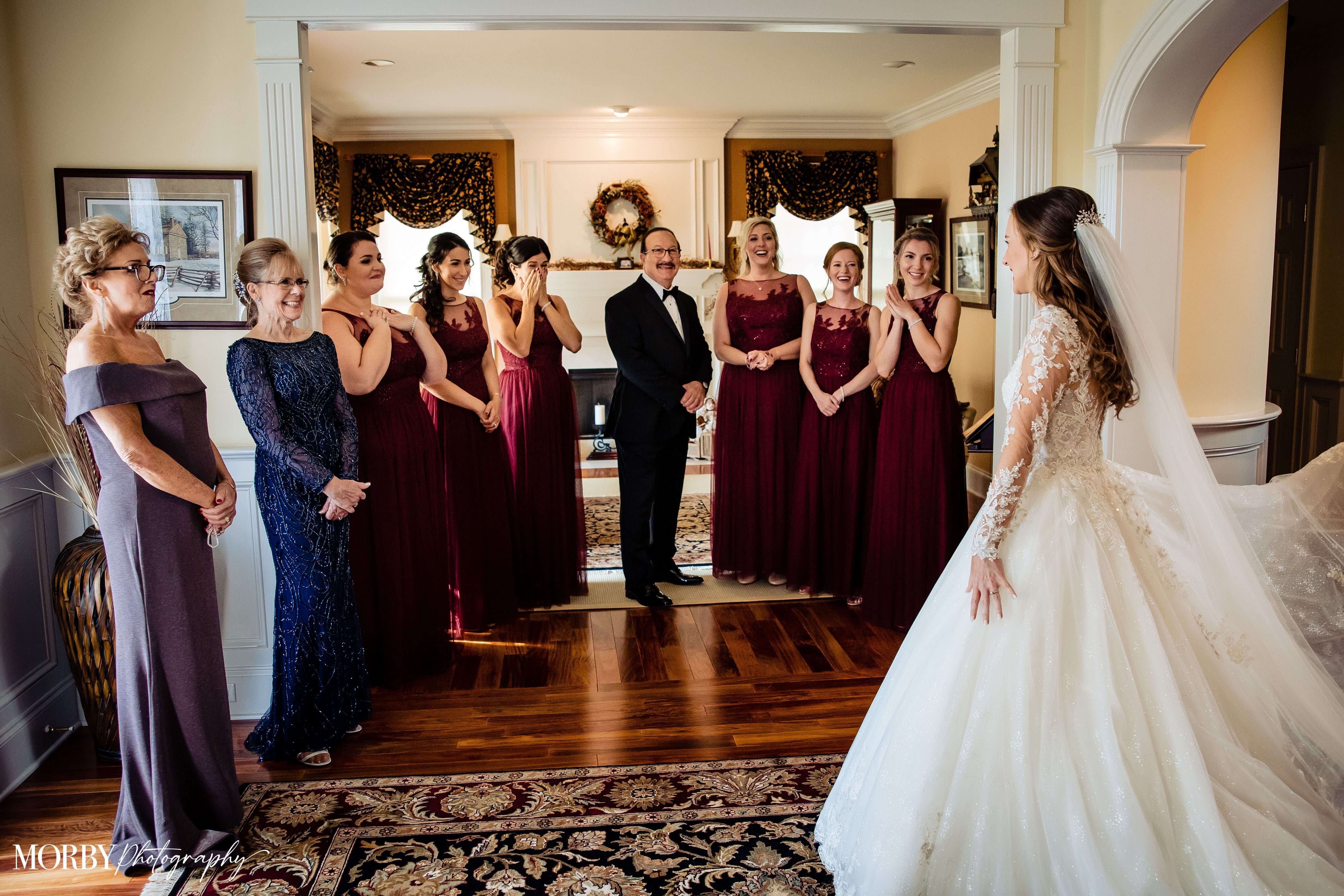 Bride Showing her Dress To Bridesmaids